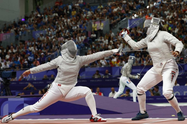 Paris 2024 Olympics - Fencing - Women's Sabre Individual Table of 16 - Grand Palais, Paris, France - July 29, 2024. Hayoung Jeon of South Korea in action against Nada Hafez of Egypt.